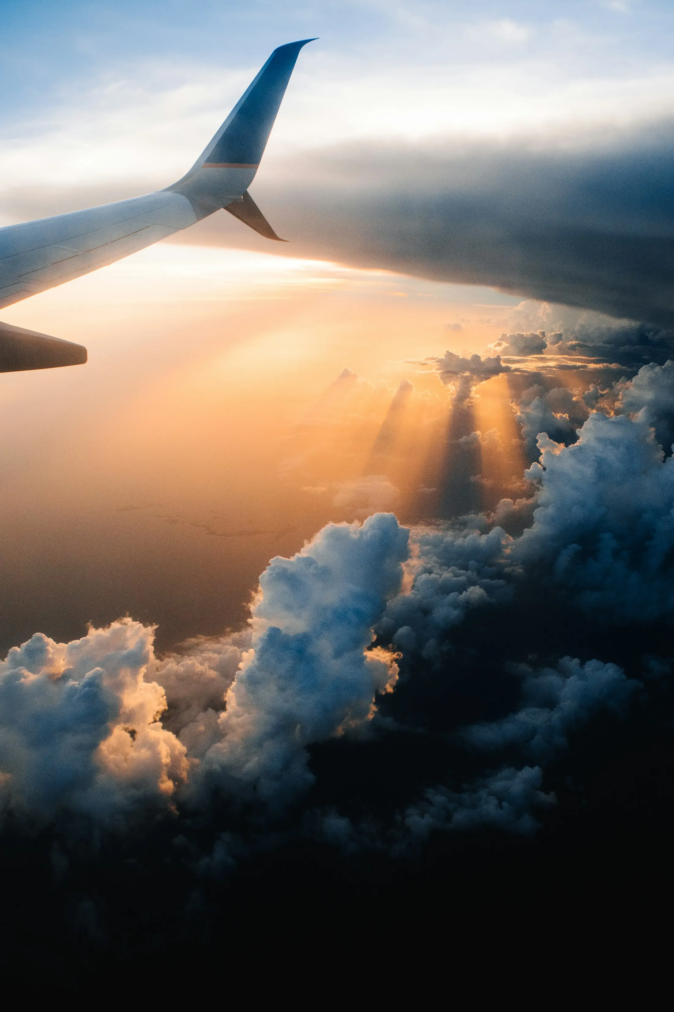 Sun breaking through clouds, seen from above